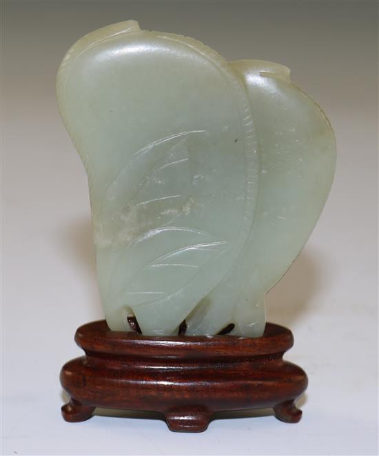 A Chinese celadon jade carving of gourds, 18th/19th century, 6cm, wood stand